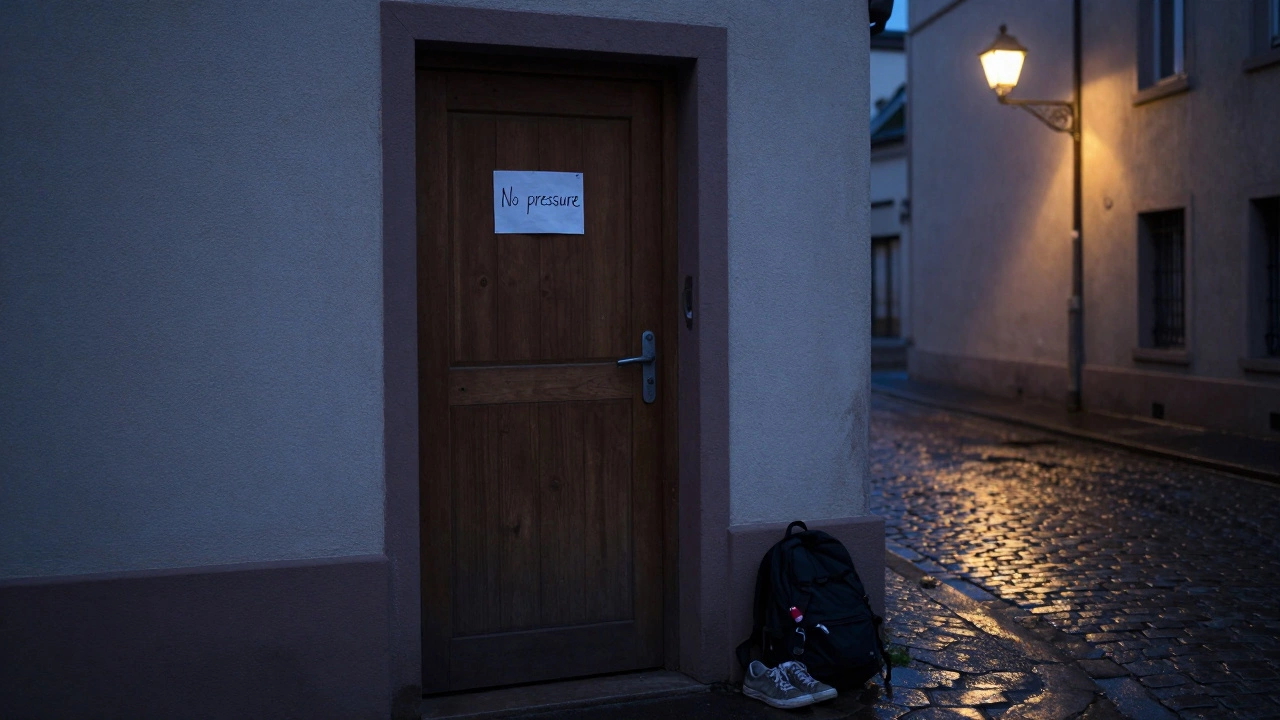 A handwritten note on a door in a quiet Strasbourg alley, sneakers left outside.